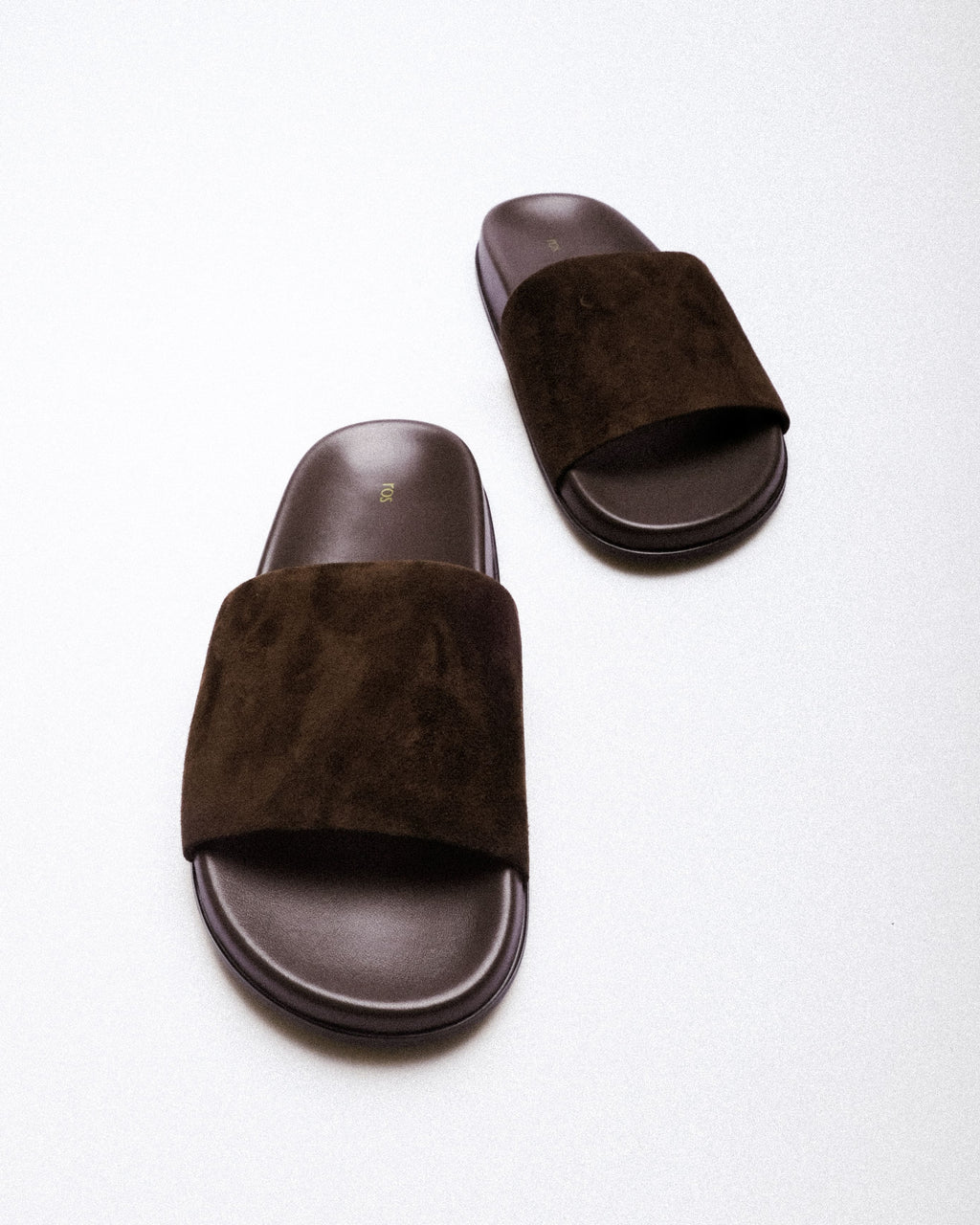 Thea Slide — Polished Leather Footbed Detail